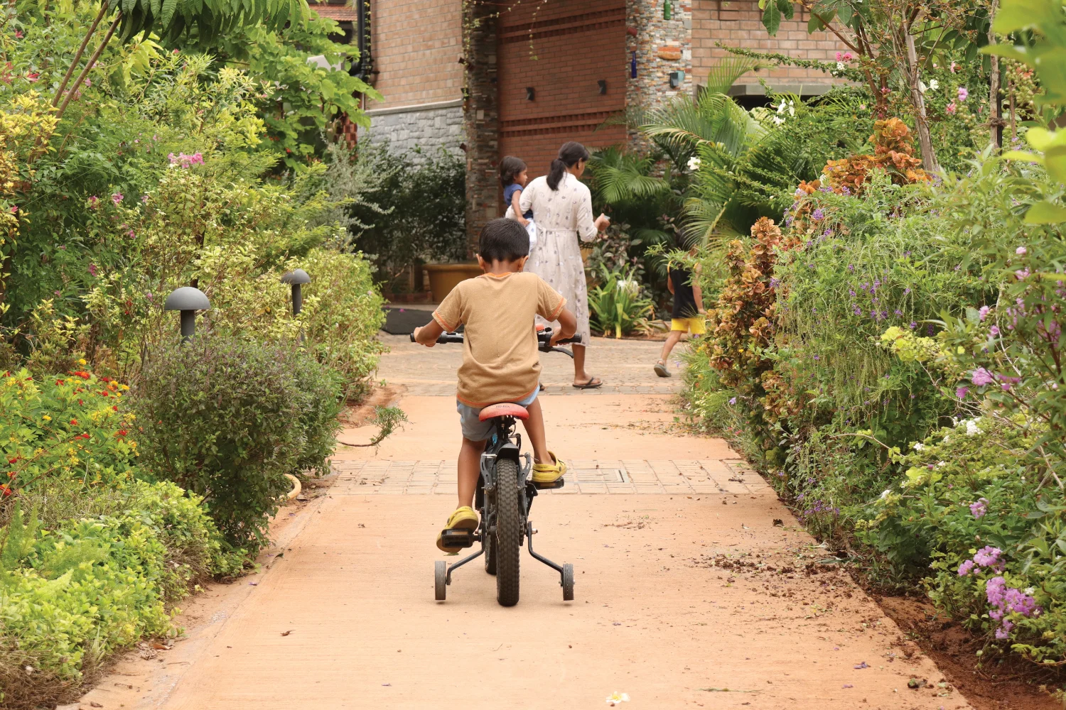 Kid cycling at GoodEarth Malhar
