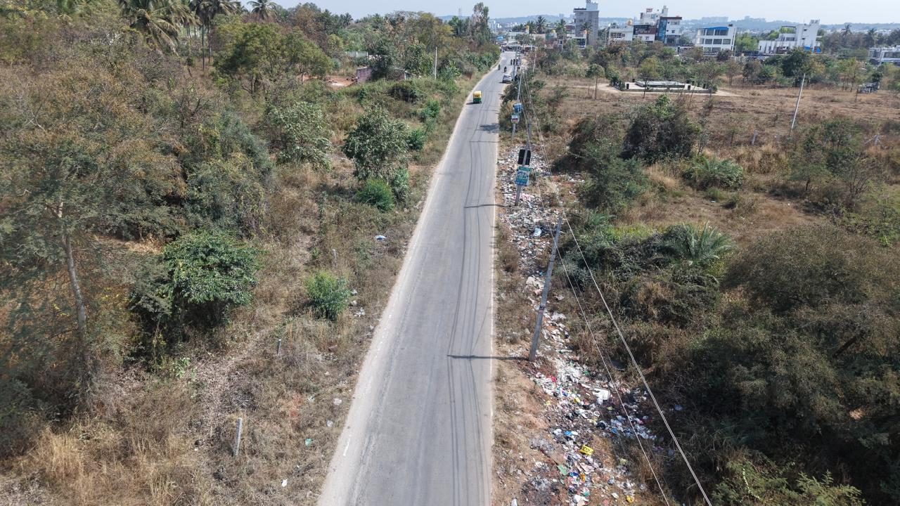 Wide aerial view of roadside litter near Doddabele
